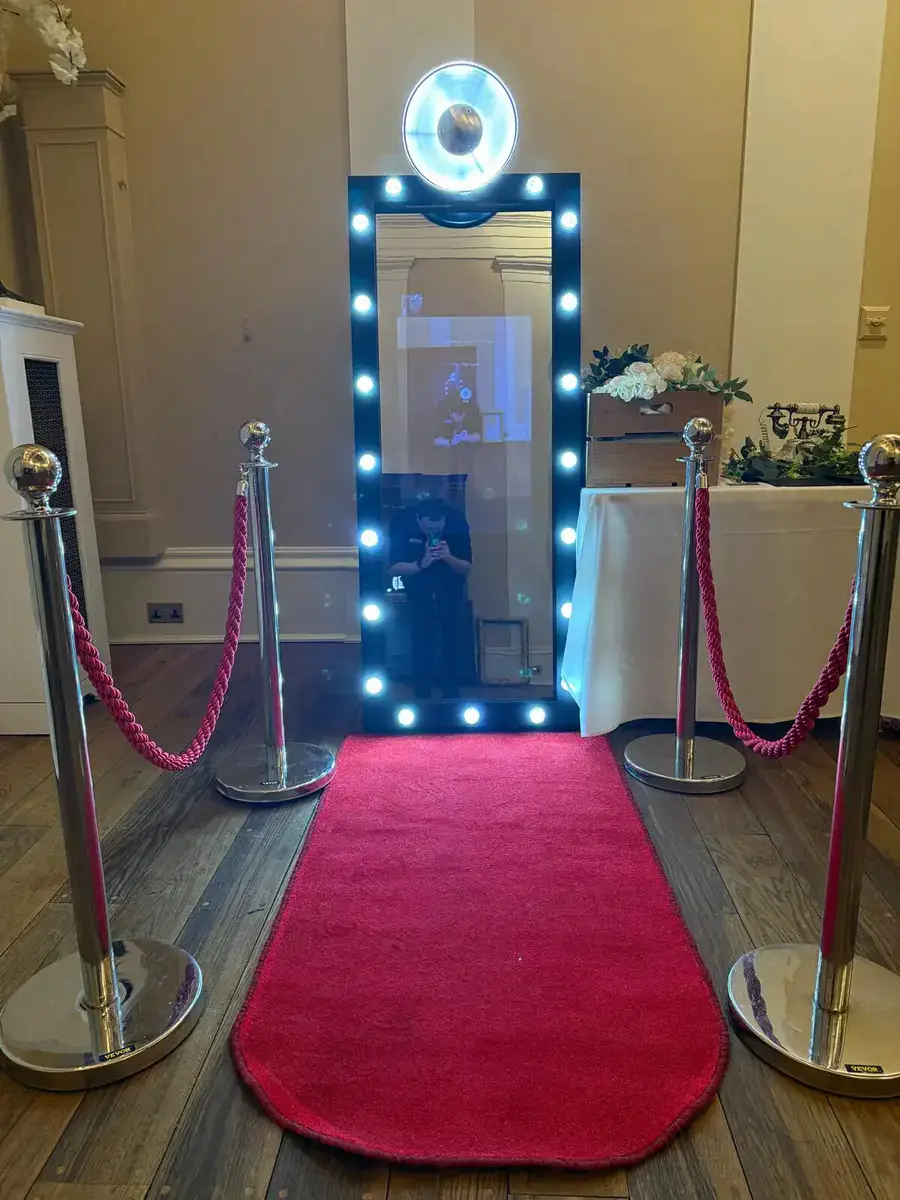 Selfie Magic Mirror photo booth with a red carpet