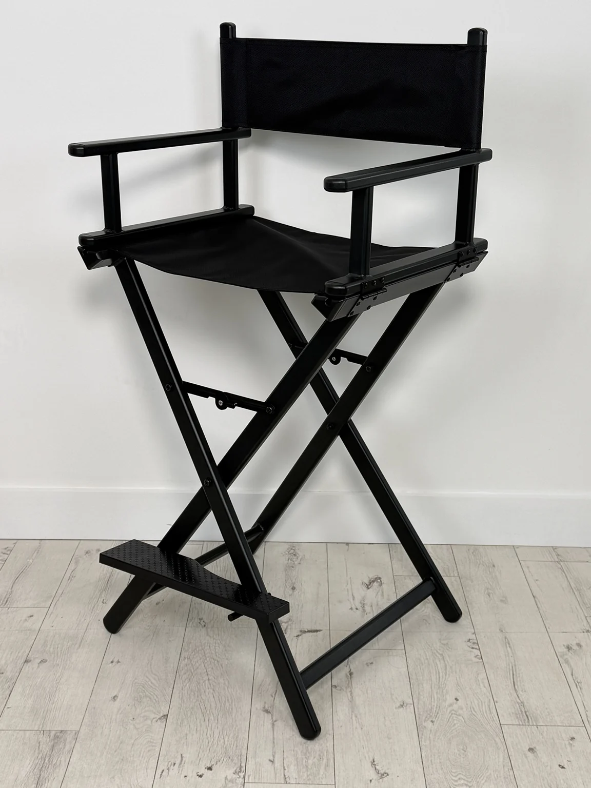 Black director’s chair with footrest at Selfie Studios in Bulkington