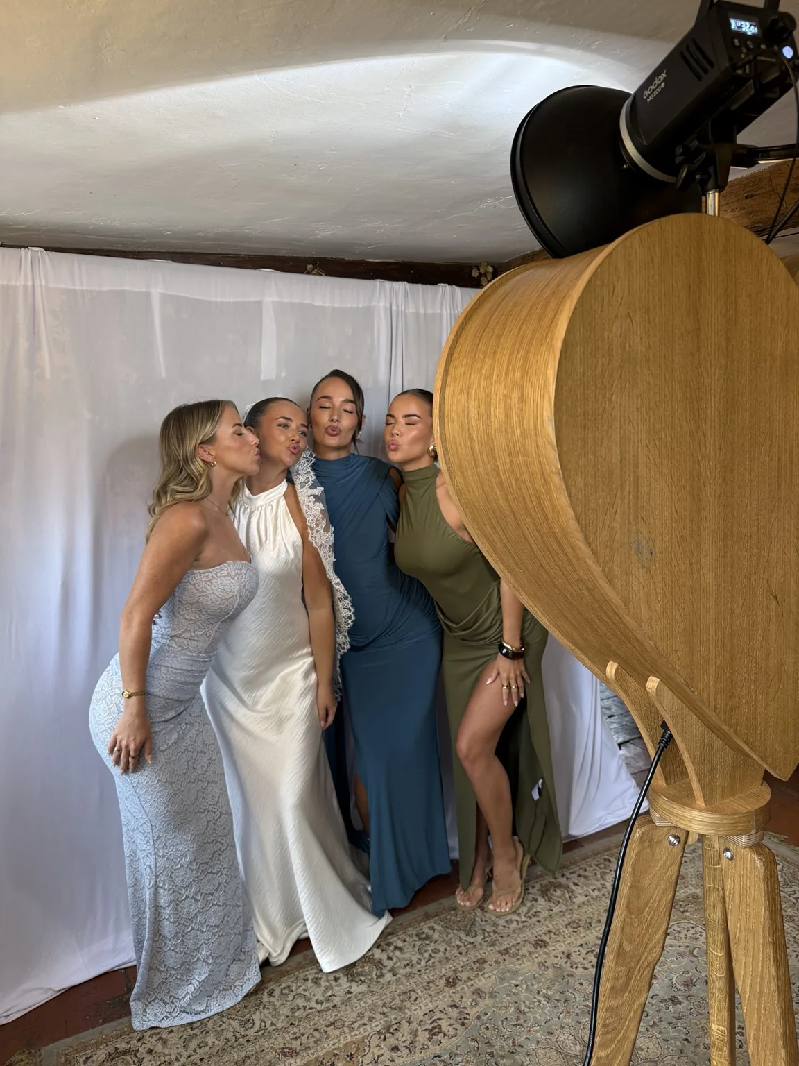 Behind the scenes: four guests using the Rustic Heart with white drapes