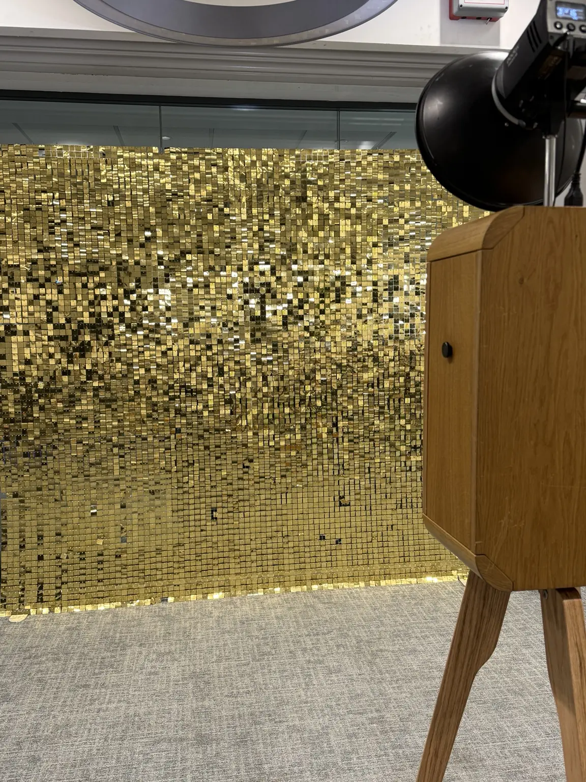 Gold shimmer sequin wall photographed at an event